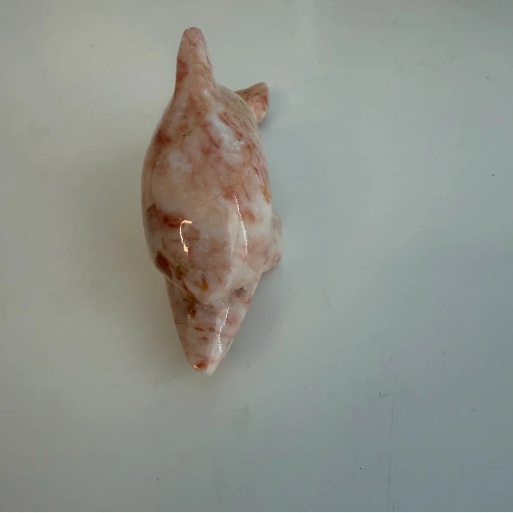 Alabaster stone marbled pink dolphin figure.
